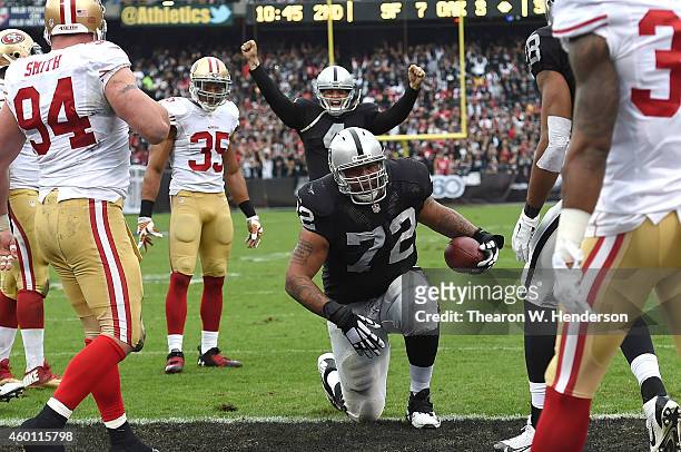 Donald Penn of the Oakland Raiders finishes a touchdown run against the San Francisco 49ers in the second quarter at O.co Coliseum on December 7,...
