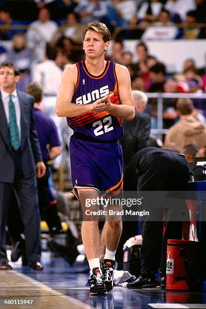 Danny Ainge of the Phoenix Suns walks against the Golden State Warriors during a game played in 1993 at the Oakland-Alameda County Coliseum Arena in...