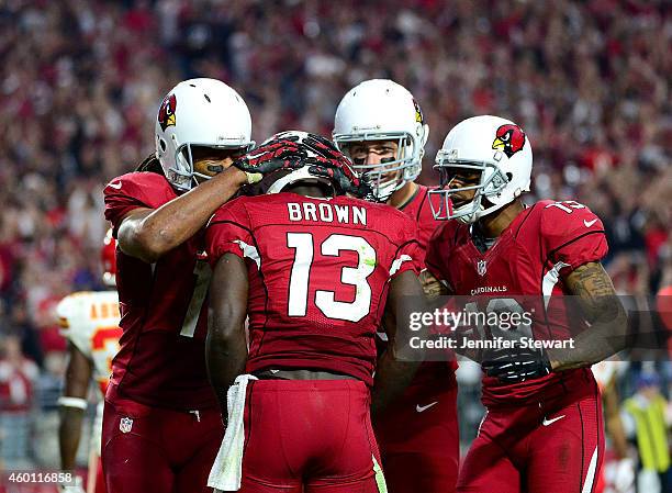 Wide receiver Larry Fitzgerald of the Arizona Cardinals, wide receiver Jaron Brown, tight end John Carlson and wide receiver Ted Ginn celebrate...