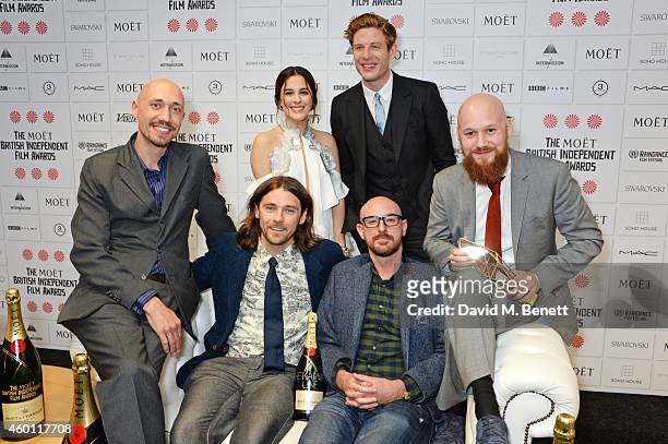 Tiernan Hanby, Oscar Sharp and guests, winners of the Best Short Film award for "The Karman Line", pose with presenters Phoebe Fox and James Norton...