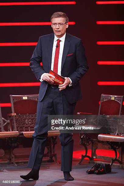 Host Guenther Jauch moderates without his shoes the 2014! Menschen, Bilder, Emotionen - RTL Jahresrueckblick show on December 7, 2014 in Cologne,...