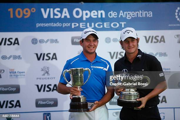 Alejandro Tosti and Emiliano Grillo of Argentina celebrate with their trophies during the closing day of the 109th VISA Open Argentina as part of PGA...