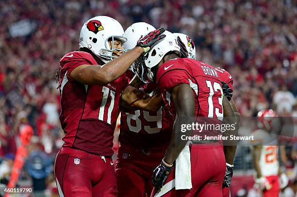Wide receiver Larry Fitzgerald of the Arizona Cardinals , wide receiver Jaron Brown and tight end John Carlson celebrate Brown's third quarter...
