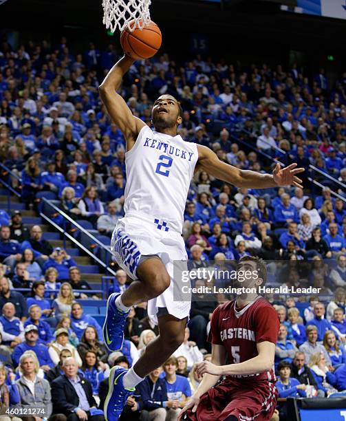 Kentucky Wildcats guard Aaron Harrison drives in for a dunk on the fast break on Sunday, Dec. 7 in Lexington, Ky.