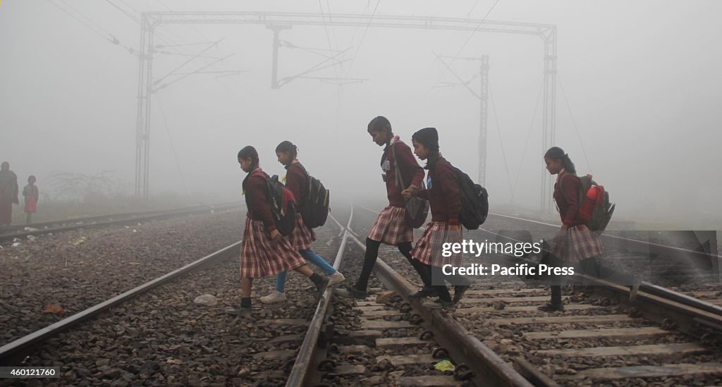 Students take risk their lives in crossing  the railway...