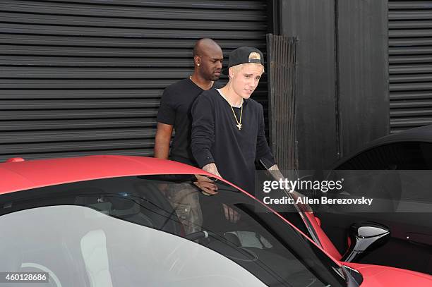 Singer Justin Bieber attends the Grand Opening of West Coast Customs Burbank Headquarters at West Coast Customs on December 7, 2014 in Burbank,...