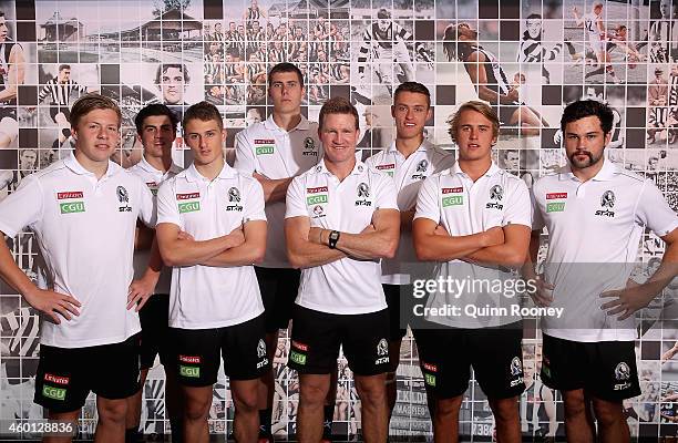 Magpies coach Nathan Buckley poses with Jordan De Goey, Brayden Maynard, Matthew Goodyear, Mason Cox, Darcy Moore, Michael Manteit and Brendan Abbott...