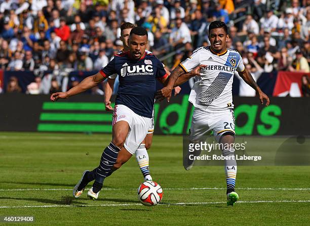 Charlie Davies of the New England Revolution handles the ball against A. J. DeLaGarza the Los Angeles Galaxy during the 2014 MLS Cup match at the at...