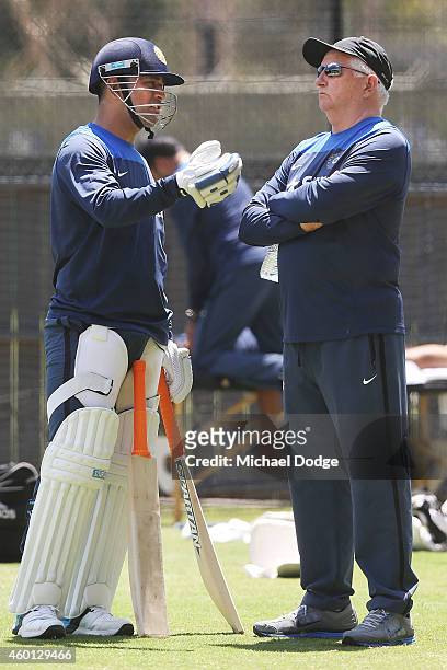 Dhoni talks to coach Duncan Fletcher during an India Training Session at Adelaide Oval on December 8, 2014 in Adelaide, Australia. Dhoni was earlier...