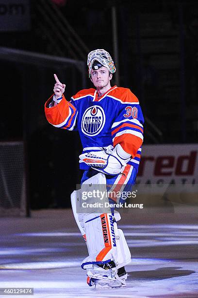 Ben Scrivens of the Edmonton Oilers salutes the crowd after earning the first star of the night after defeating the San Jose Sharks at Rexall Place...