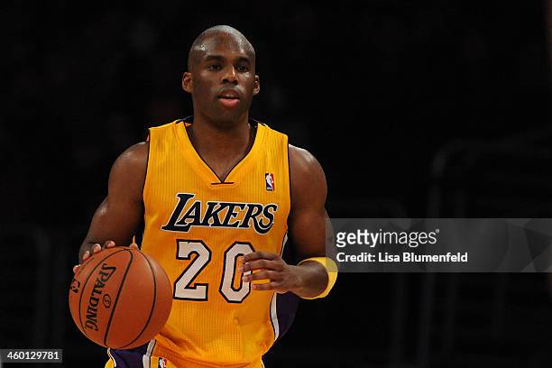 Jodie Meeks of the Los Angeles Lakers drives the ball upcourt against the Minnesota Timberwolves at Staples Center on December 20, 2013 in Los...