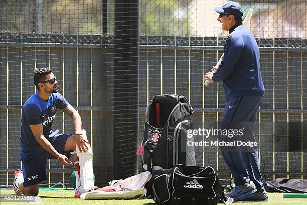 Virat Kohli talks to India Director of Cricket Ravi Shastri who reacts during an India Training Session at Adelaide Oval on December 8, 2014 in...