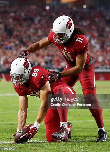 Tight end John Carlson of the Arizona Cardinals celebrates a two point conversion with Larry Fitzgerald during the third quarter of the NFL game...