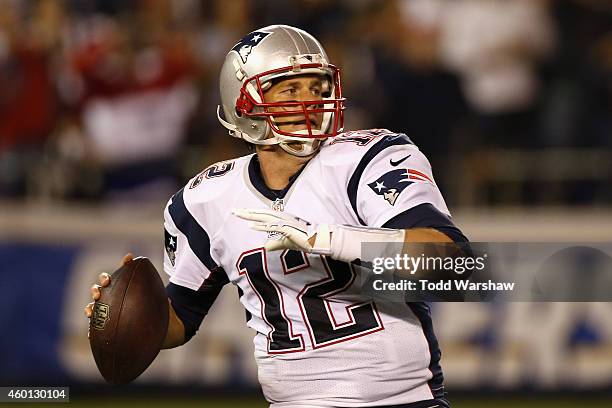 Quarterback Tom Brady of the New England Patriots looks to pass against the San Diego Charger defense at Qualcomm Stadium on December 7, 2014 in San...