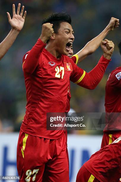 Mac Hong Quan of Vietnam celebrates after beating Malaysia 2-1 during the 2014 AFF Suzuki Cup 1st leg semi final between Malaysia and Vietnam at Shah...