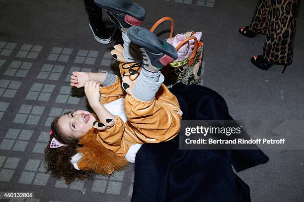 Designer Philippe Starck's daughter, Justice, doing the Lion, attends the Matinee "Reve d'enfants" with Ballet "Casse Noisette". Organized by AROP at...