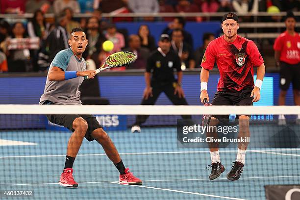 Nick Kyrgios and Lleyton Hewitt of the Singapore Slammers in action against Roger Federer and Rohan Bopanna of the Indian Aces during the Coca-Cola...