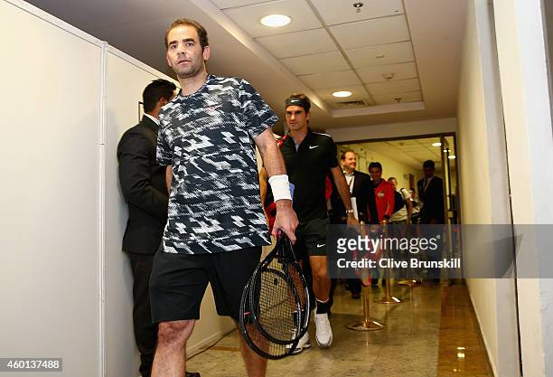 Pete Sampras of the Indian Aces walks from the locker room with team mate Roger Federer as they make their debut for the Indian Aces against the...