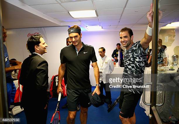 Pete Sampras of the Indian Aces with team mate Roger Federer as they make their debut for the Indian Aces against the Singapore Slammers during the...