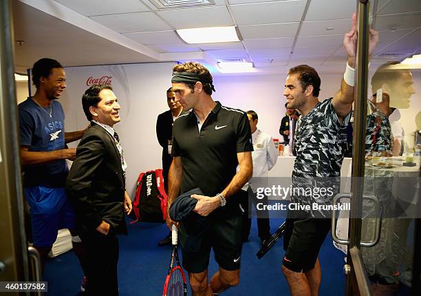 Pete Sampras of the Indian Aces with team mate Roger Federer as they make their debut for the Indian Aces against the Singapore Slammers during the...