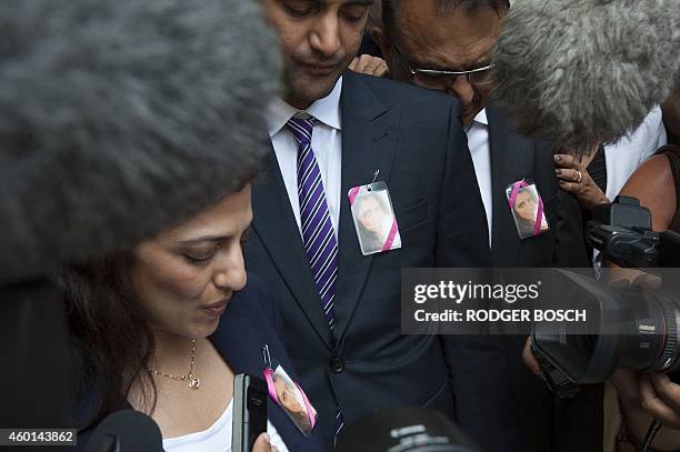 Member of the Hindocha family, including Anish and Vinod Hindocha, brother and father of murdered tourist, Anni Dewani face the waiting media, after...