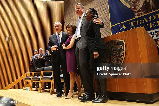 William Bratton , just sworn in as New York City's 42nd police commissioner by New York City Mayor Bill de Blasio , stands on stage at One Police...