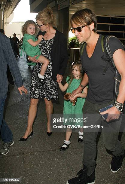 Nicole Kidman, Keith Urban and their daughters, Sunday Rose Kidman Urban and Faith Margaret Kidman Urban are seen at LAX airport on January 02, 2014...