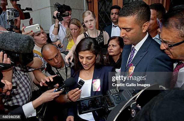 Nni Dewani's sister Ami Denborg, brother Anish Hindocha, and father, Vinod Hindoch leave the Western Cape High Court during Shrien Dewani's murder...