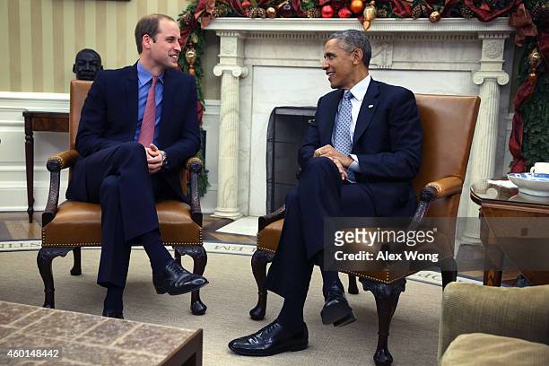 President Barack Obama meets with Prince William , Duke of Cambridge, in the Oval Office of the White House December 8, 2014 in Washington, DC....