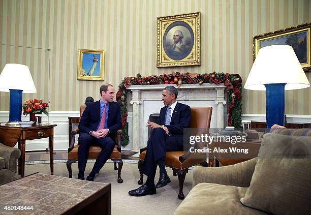 President Barack Obama meets with Prince William , Duke of Cambridge, in the Oval Office of the White House December 8, 2014 in Washington, DC....