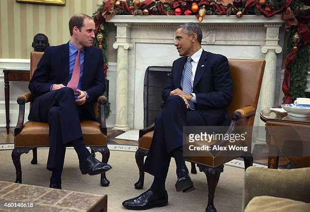 President Barack Obama meets with Prince William , Duke of Cambridge, in the Oval Office of the White House December 8, 2014 in Washington, DC....