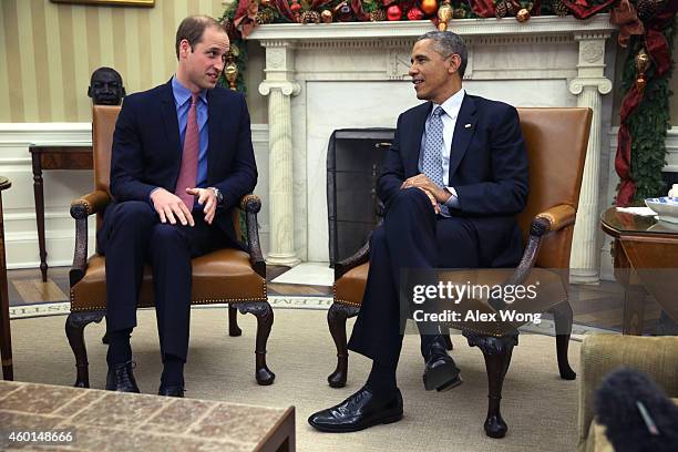 President Barack Obama meets with Prince William , Duke of Cambridge, in the Oval Office of the White House December 8, 2014 in Washington, DC....