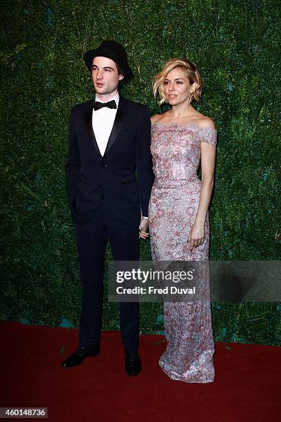 Tom Sturridge and Sienna Miller attends the 60th London Evening Standard Theatre Awards at London Palladium on November 30, 2014 in London, England.