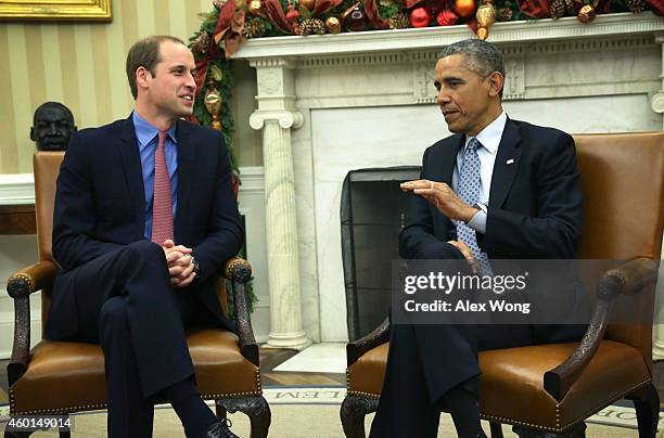 President Barack Obama meets with Prince William , Duke of Cambridge, in the Oval Office of the White House December 8, 2014 in Washington, DC....