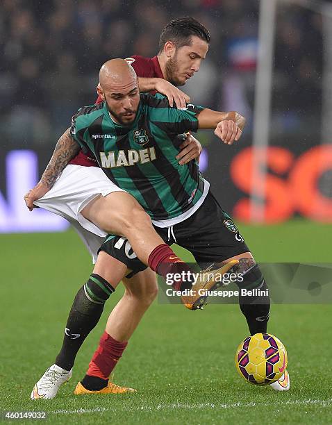 Kostas Manolas of AS Roma and Simone Zaza of US Sassuolo in action during the Serie A match between AS Roma and US Sassuolo Calcio at Stadio Olimpico...