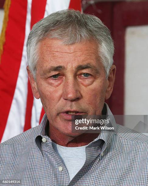 Secretary of Defense Chuck Hagel speaks to members of the media after visiting with U.S. Troops, December 8, 2014 at Camp Buehring, Kuwait. Secretary...