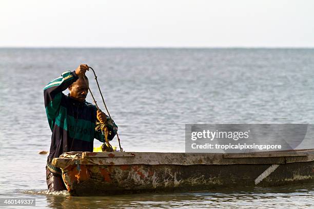 gabon, estuaire province, fisherman and boat. - libreville stock pictures, royalty-free photos & images