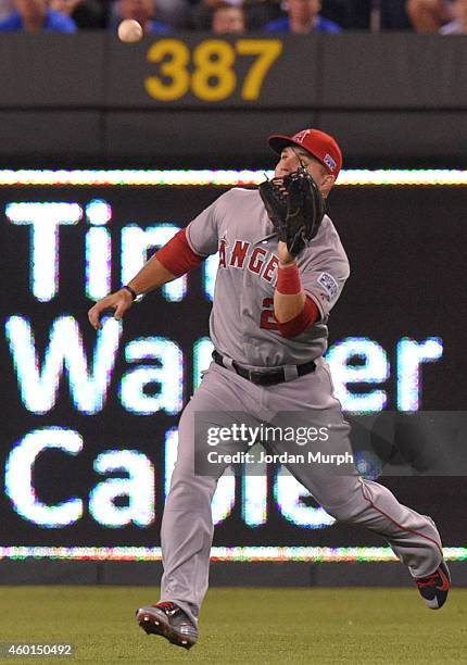 Mike Trout of the Los Angeles Angels of Anaheim catches the ball during game 3 of the American League Division Series against the Kansas City Royals...