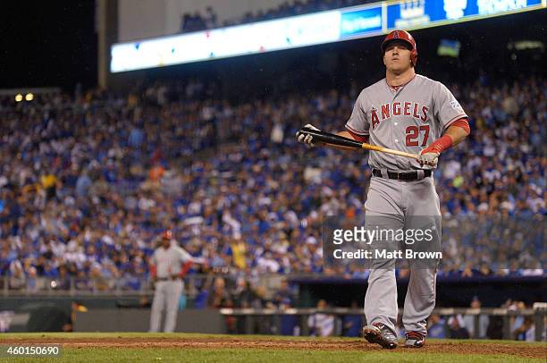 Mike Trout of the Los Angeles Angels of Anaheim walks towards the dugout after striking out during game 3 of the American League Division Series...