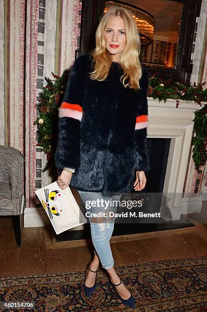 Poppy Delevingne attends a VIP screening of "St. Vincent" hosted by Poppy Delevingne at The Covent Garden Hotel on December 8, 2014 in London,...