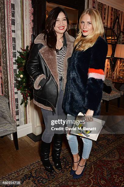 Daisy Lowe and Poppy Delevingne attend a VIP screening of "St. Vincent" hosted by Poppy Delevingne at The Covent Garden Hotel on December 8, 2014 in...