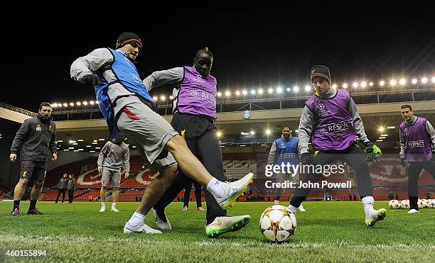 Dejan Lovren, Mamadou Sakho and Philippe Coutinho of Liverpool during a training session on December 8, 2014 in Liverpool, United Kingdom.