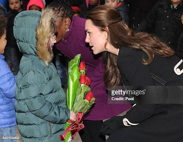 Catherine, Duchess of Cambridge, greets children during a visit with Chirlane McCray, the first lady of New York, to the Northside Center for Child...