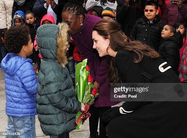 Catherine, Duchess of Cambridge, greets children during a visit with Chirlane McCray, the first lady of New York, to the Northside Center for Child...