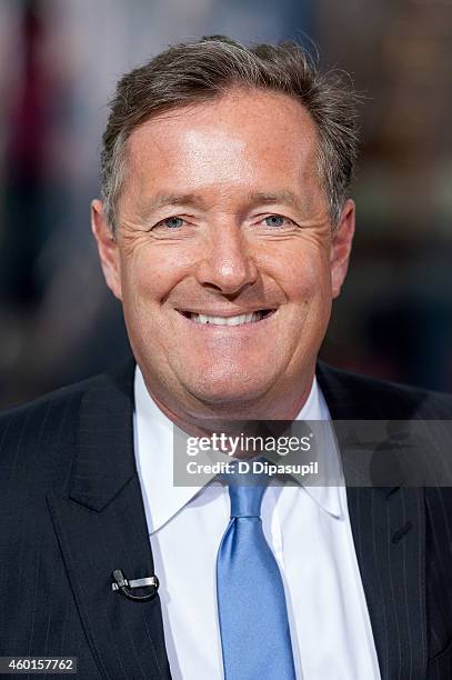 Piers Morgan visits 'Extra' at their New York studios at H&M in Times Square on December 8, 2014 in New York City.