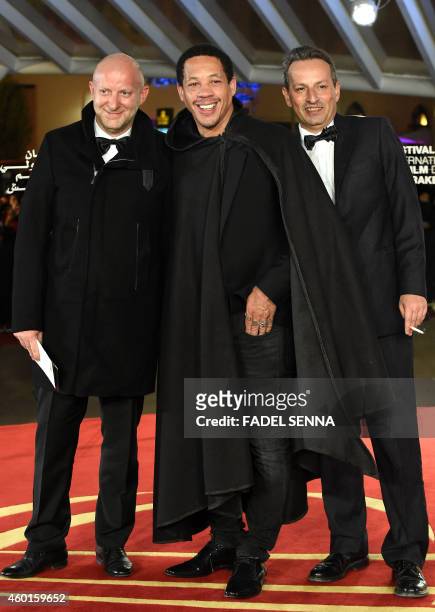 Didier Morville AKA Joey starr poses for photographers with producers on the red carpet for the movie 'Silent Heart' during the 14th Marrakesh...