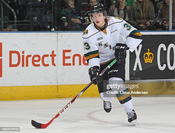 Julius Bergman of the London Knights skates with the puck against the North Bay Battalion in an OHL game at Budweiser Gardens on December 7, 2014 in...