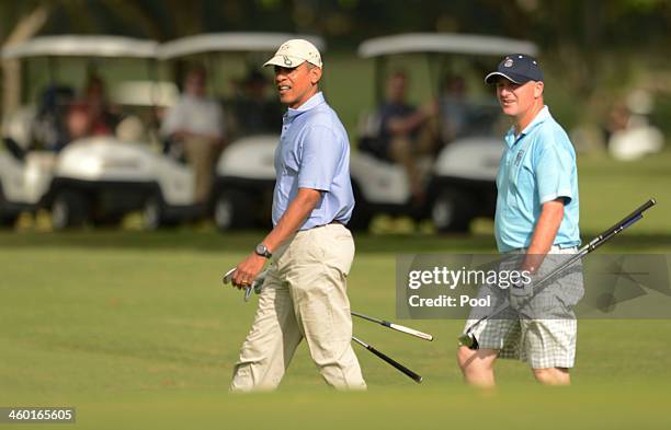 President Barack Obama and Prime Minister of New Zealand John Key approach the second green while playing golf at the Marine Corps Base Hawaii's...