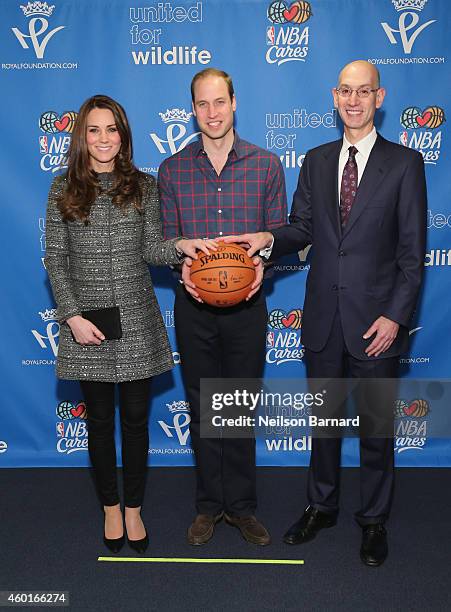 Prince William, Duke of Cambridge and Catherine, Duchess of Cambridge pose with NBA Commissioner Adam Silver as they attend the Cleveland Cavaliers...