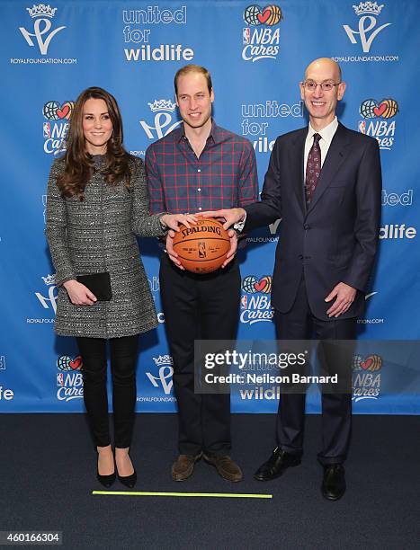 Prince William, Duke of Cambridge and Catherine, Duchess of Cambridge pose with NBA Commissioner Adam Silver as they attend the Cleveland Cavaliers...